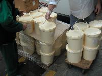 unloading a pallet of creme fraiche at Berthillon on Ile St Louis, Paris